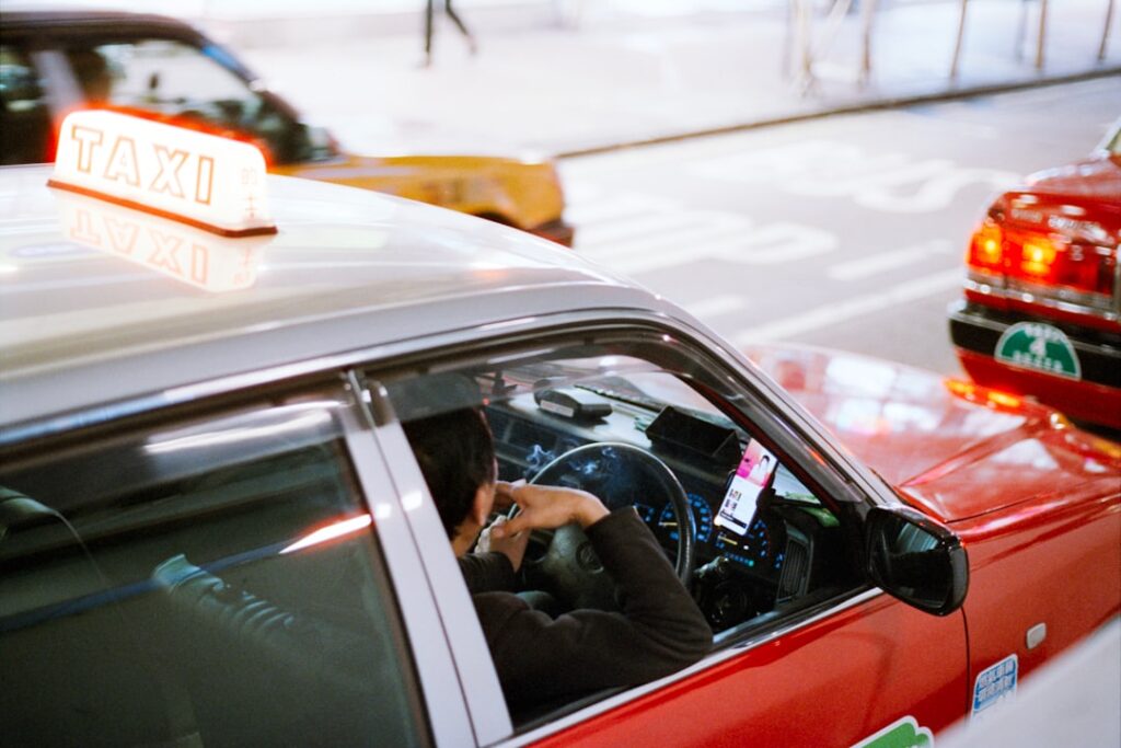 A taxi driver ready to take a booking — book your wheelchair taxi in Dorset