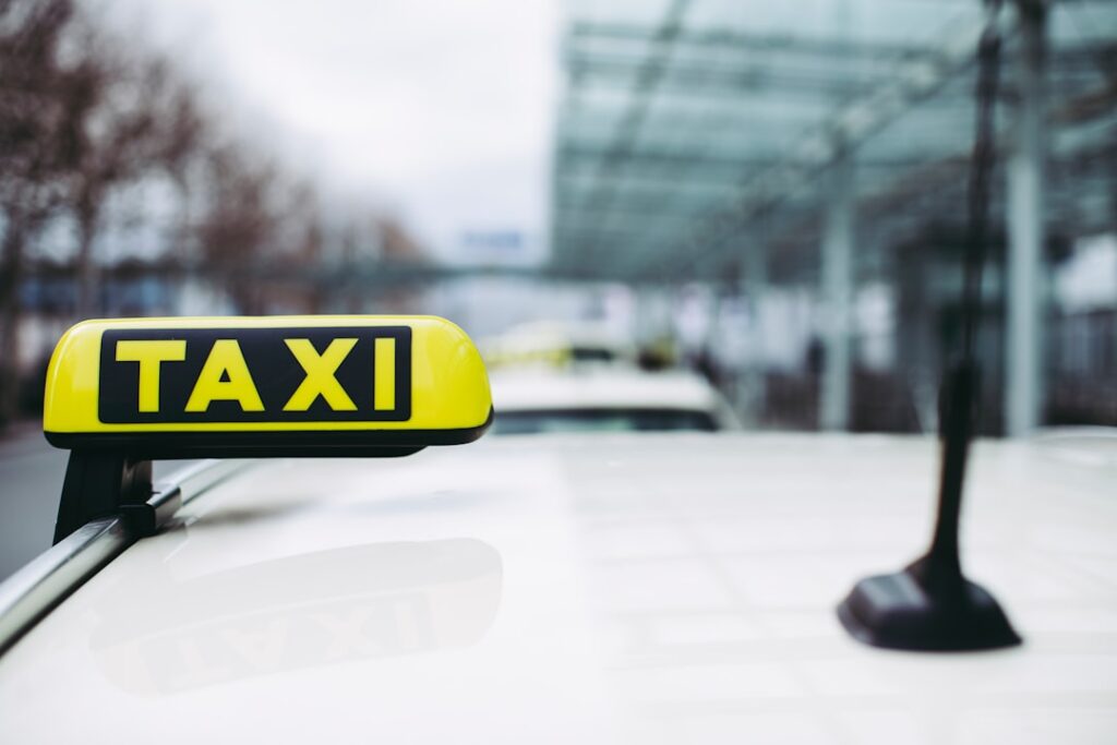 Taxi sign at airport for group airport transfer booking from Dorset