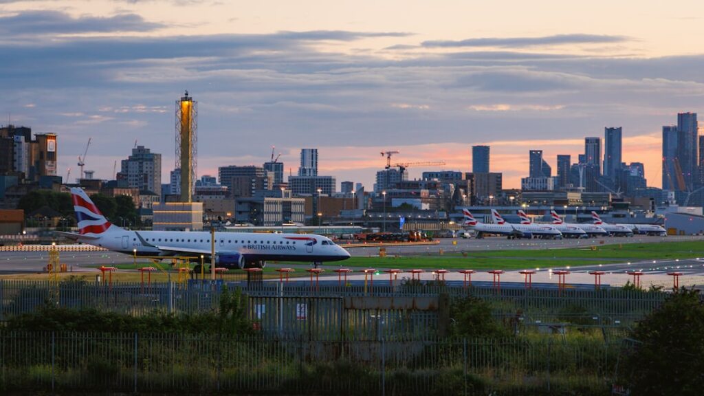 British Airways aircraft on airport runway at dusk — UK airport departure scene for Dorset to Bristol Airport transfers