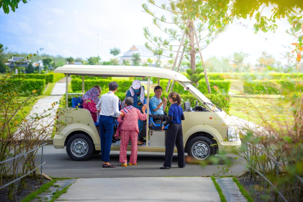 Group of passengers boarding a minibus van for a group airport transfer